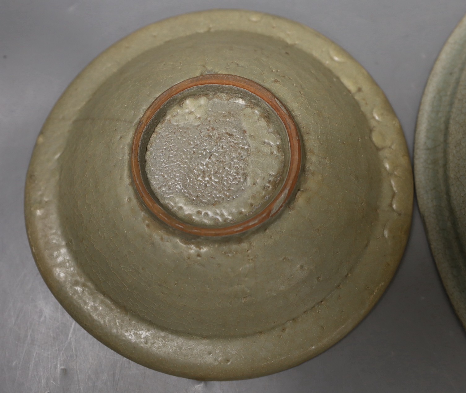A Chinese celadon dish, probably Southern Song Dynasty, 17.5cm and a Thai Sawankhalok celadon deep dish, 16th century, largest 27cm